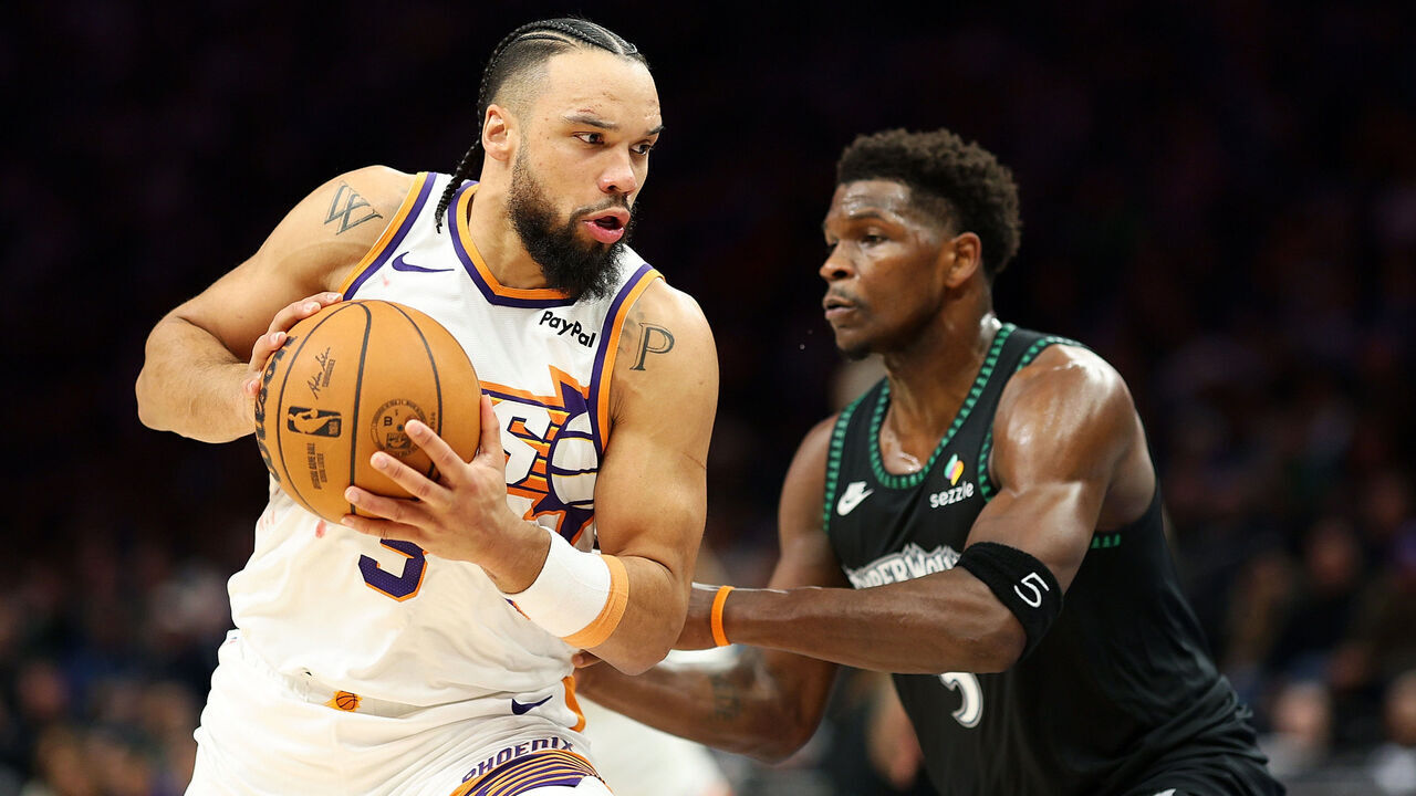MINNEAPOLIS, MINNESOTA - DECEMBER 08: Dillon Brooks #3 of the Phoenix Suns goes to the basket against Anthony Edwards #5 of the Minnesota Timberwolves in the third quarter at Target Center on December 08, 2025 in Minneapolis, Minnesota. The Suns defeated the Timberwolves 108-105.