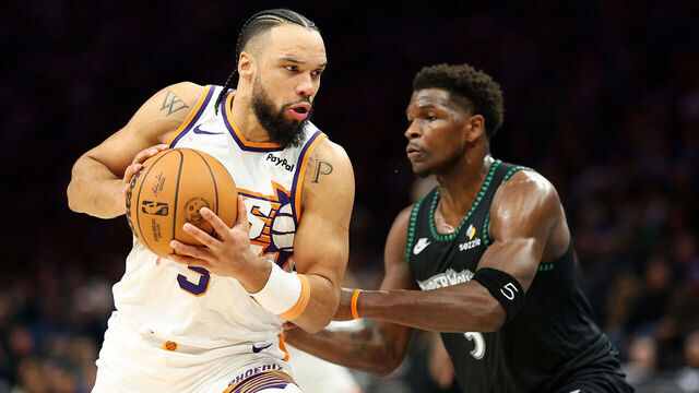 MINNEAPOLIS, MINNESOTA - DECEMBER 08: Dillon Brooks #3 of the Phoenix Suns goes to the basket against Anthony Edwards #5 of the Minnesota Timberwolves in the third quarter at Target Center on December 08, 2025 in Minneapolis, Minnesota. The Suns defeated the Timberwolves 108-105.