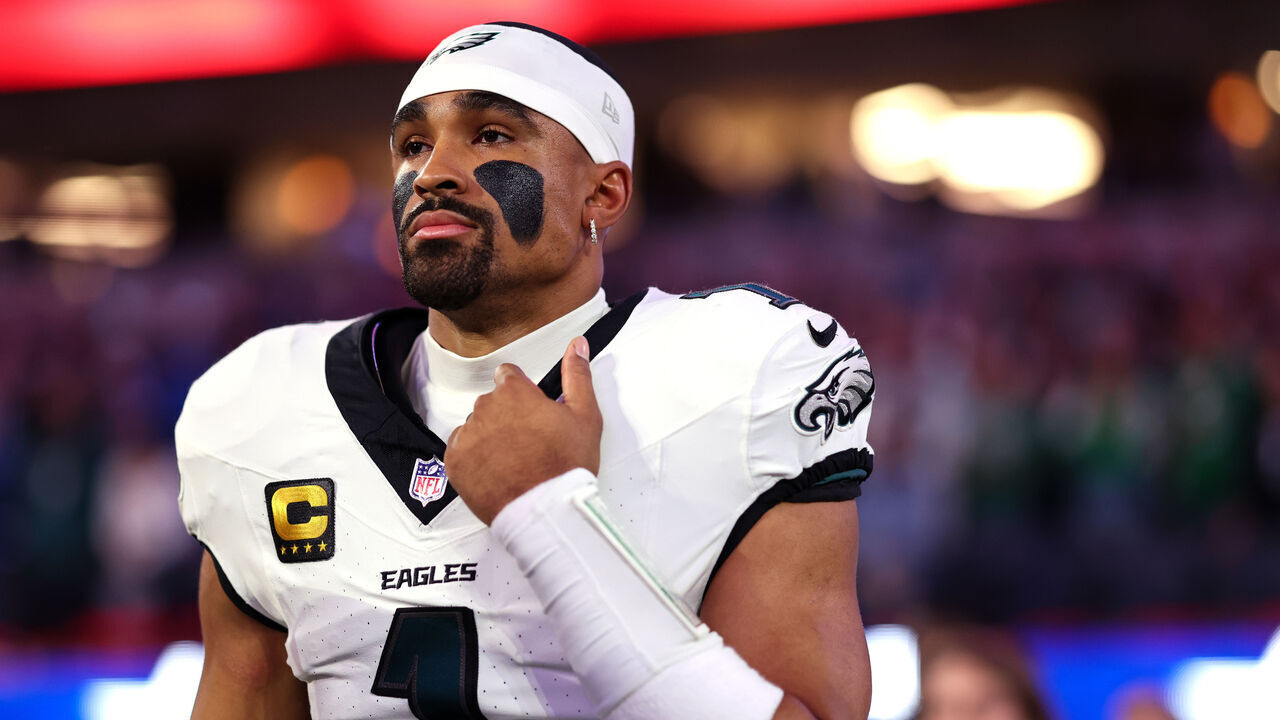 INGLEWOOD, CALIFORNIA - DECEMBER 8: Jalen Hurts #1 of the Philadelphia Eagles stands on the sideline during the national anthem prior to the game against the Los Angeles Chargers at SoFi Stadium on December 8, 2025 in Inglewood, California.