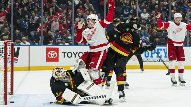 VANCOUVER, CANADA - DECEMBER 8: Nate Danielson #29 of the Detroit Red Wings celebrates after redirecting a shot past goalie Kevin Lankinen #32 of the Vancouver Canucks for a goal during the second period of NHL action at Rogers Arena on December 8, 2025 in Vancouver, Canada. Marcus Pettersson #29 of the Vancouver Canucks tried to help defend on the play.