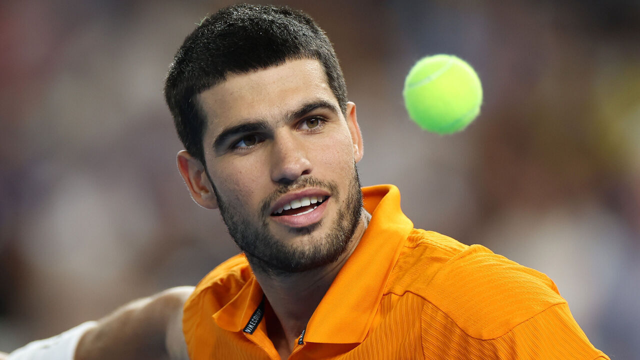 MIAMI, FLORIDA - DECEMBER 08: Carlos Alcaraz of Spain hits a ball to fans after winning against Joao Fonseca of Brazil during the Miami Invitational at loanDepot park on December 08, 2025 in Miami, Florida.
