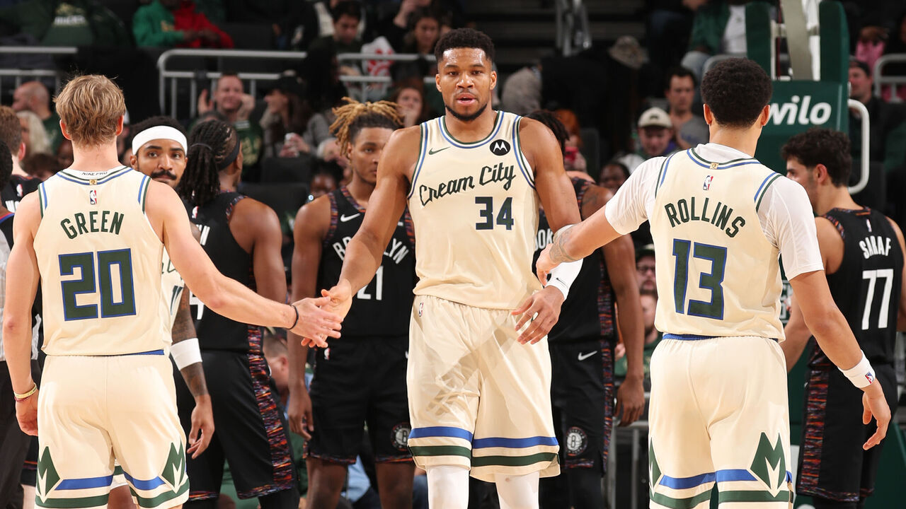 MILWAUKEE, WI - NOVEMBER 29: AJ Green #20, Giannis Antetokounmpo #34 and Ryan Rollins #13 of the Milwaukee Bucks high five during the game against the Boston Celtics on November 29, 2025 at Fiserv Forum Center in Milwaukee, Wisconsin. Mandatory Copyright Notice: Copyright 2025 NBAE .