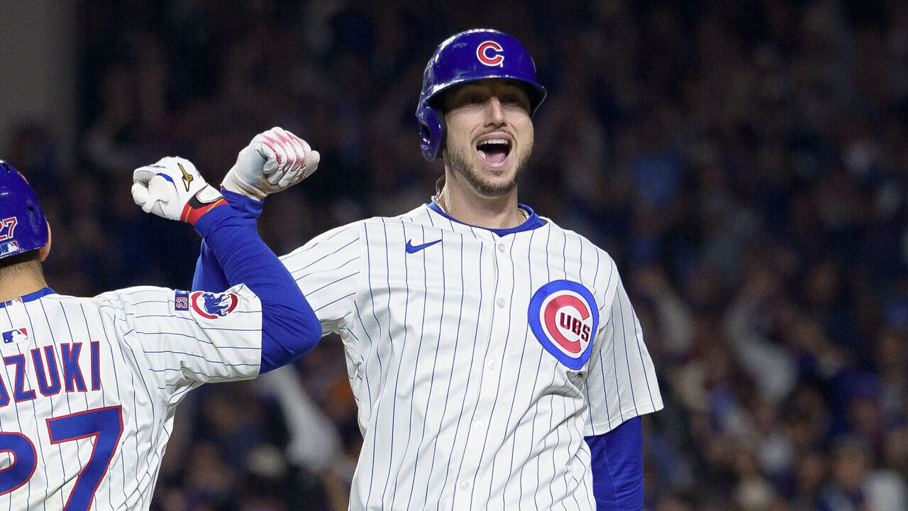 CHICAGO, ILLINOIS - OCTOBER 09: Kyle Tucker #30 of the Chicago Cubs celebrates a home run with Seiya Suzuki #27 during the seventh inning of Game Four of the National League Division Series against the Milwaukee Brewers at Wrigley Field on October 9, 2025 in Chicago, Illinois.