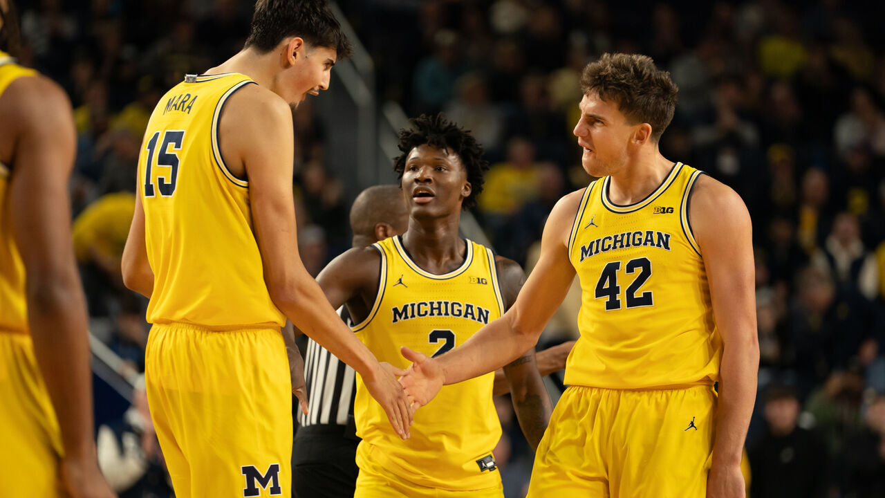 ANN ARBOR, MICHIGAN - DECEMBER 9: Aday Mara #15, L.J. Cason #2 and Will Tschetter #42 of the Michigan Wolverines celebrate a first half play against the Villanova Wildcats at Crisler Arena on December 9, 2025 in Ann Arbor, Michigan.