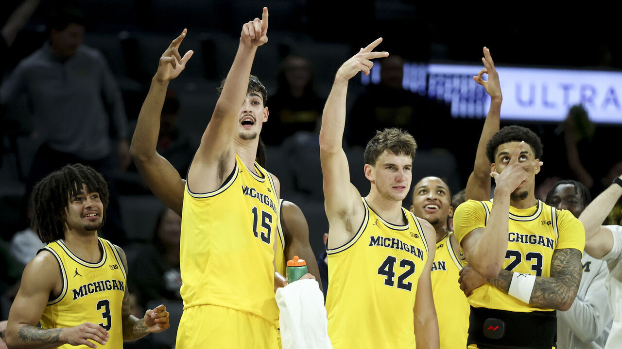 LAS VEGAS, NEVADA - NOVEMBER 25: Elliot Cadeau #3, Aday Mara #15, Will Tschetter #42, and Yaxel Lendeborg #23 of the Michigan Wolverines celebrate after their team's 3-point basket against the Auburn Tigers during the second half of a Players Era Championship basketball tournament game at Michelob ULTRA Arena on November 25, 2025 in Las Vegas, Nevada.