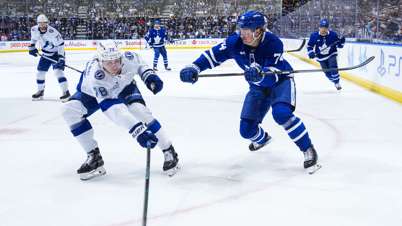 TORONTO, CANADA - DECEMBER 8: =v72= and Bobby McMann #74 of the Toronto Maple Leafs battle for the puck during the first period at the Scotiabank Arena on December 8, 2025 in Toronto, Ontario, Canada.