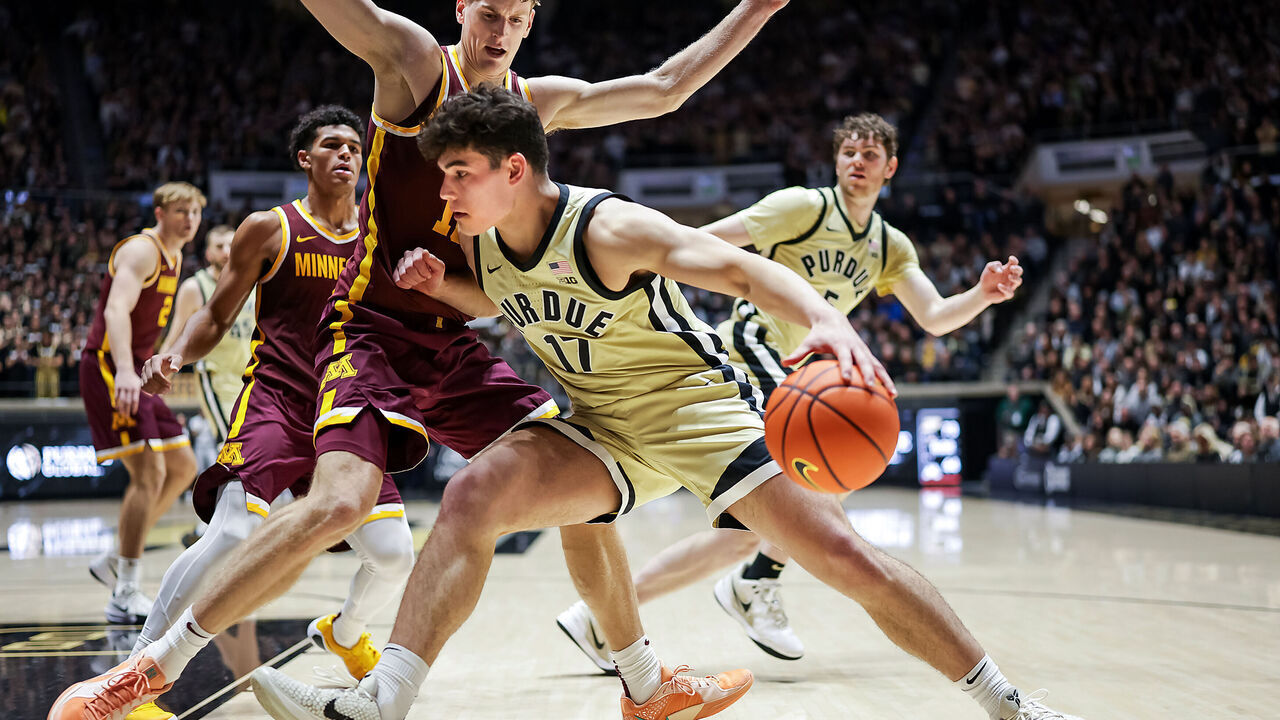 WEST LAFAYETTE, INDIANA - DECEMBER 10: Omer Mayer #17 of the Purdue Boilermakers drives to the basket against Cade Tyson #10 of the Minnesota Golden Gophers during the second half at Mackey Arena on December 10, 2025 in West Lafayette, Indiana.
