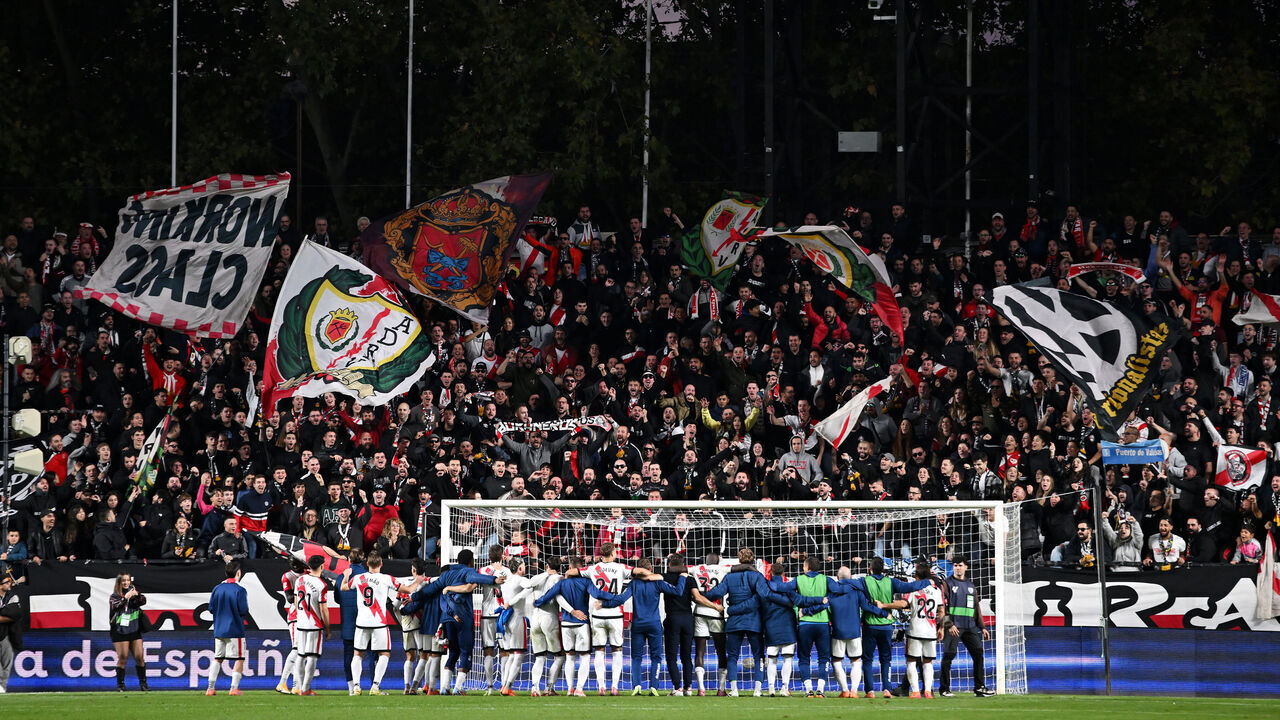 MADRID, SPAIN - NOVEMBER 09: Fans of Rayo Vallecano show their support by waving flags as players of Rayo Vallecano line up following the LaLiga EA Sports match between Rayo Vallecano de Madrid and Real Madrid CF at Estadio de Vallecas on November 09, 2025 in Madrid, Spain.