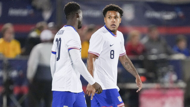 COMMERCE CITY, COLORADO - OCTOBER 14: Weston McKennie #8 and Folarin Balogun #20 of the United States talk during an international friendly game between Australia and the United States at Dick's Sporting Goods Park on October 14, 2025 in Commerce City, Colorado.