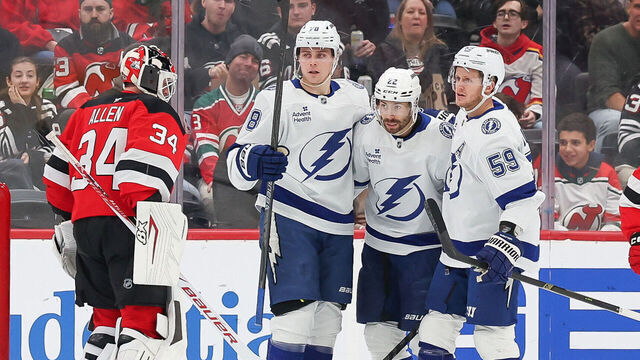 NEWARK, NEW JERSEY - DECEMBER 11: Oliver Bjorkstrand #22 of the Tampa Bay Lightning celebrates with Emil Lilleberg #78 and Jake Guentzel #59 after scoring a goal during the second period of a NHL game against the New Jersey Devils at Prudential Center on December 11, 2025 in Newark, New Jersey.