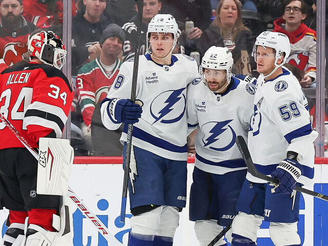 NEWARK, NEW JERSEY - DECEMBER 11: Oliver Bjorkstrand #22 of the Tampa Bay Lightning celebrates with Emil Lilleberg #78 and Jake Guentzel #59 after scoring a goal during the second period of a NHL game against the New Jersey Devils at Prudential Center on December 11, 2025 in Newark, New Jersey.