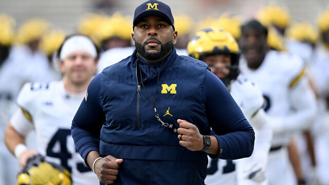 COLLEGE PARK, MARYLAND - NOVEMBER 22: Head coach Sherrone Moore of the Michigan Wolverines leads his team off the field after warm-ups before the game against the Maryland Terrapins at SECU Stadium on November 22, 2025 in College Park, Maryland.
