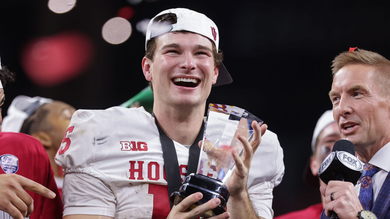 INDIANAPOLIS, INDIANA - DECEMBER 6: Fernando Mendoza #15 of the Indiana Hoosiers holds the MVP trophy after the 2025 Big Ten Championship game against the Ohio State Buckeyes at Lucas Oil Stadium on December 6, 2025 in Indianapolis, Indiana.
