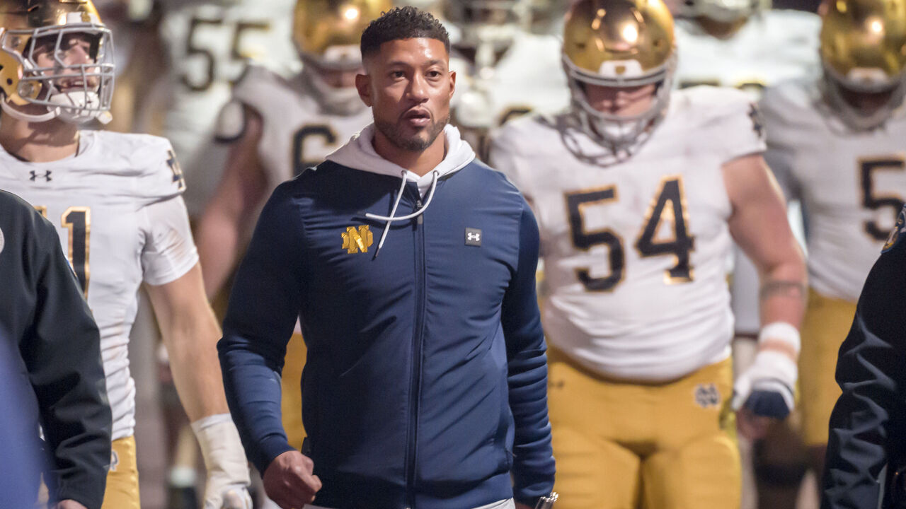 PALO ALTO, CA - NOVEMBER 29: Head Coach Marcus Freeman of the Notre Dame Fighting Irish leads his team into the stadium to start the second half of a college football game against the Stanford Cardinal on November 29, 2025 at Stanford Stadium in Palo Alto, California.