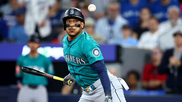 TORONTO, ONTARIO - OCTOBER 19: Jorge Polanco #7 of the Seattle Mariners fouls a ball during the eighth inning against the Toronto Blue Jays in game six of the American League Championship Series at Rogers Centre on October 19, 2025 in Toronto, Ontario.