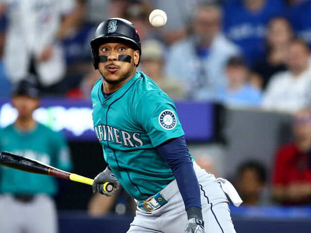 TORONTO, ONTARIO - OCTOBER 19: Jorge Polanco #7 of the Seattle Mariners fouls a ball during the eighth inning against the Toronto Blue Jays in game six of the American League Championship Series at Rogers Centre on October 19, 2025 in Toronto, Ontario.