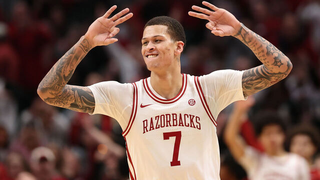 DALLAS, TEXAS - DECEMBER 13: Trevon Brazile #7 of the Arkansas Razorbacks reacts after scoring during the second half against the Texas Tech Red Raiders at American Airlines Center on December 13, 2025 in Dallas, Texas.