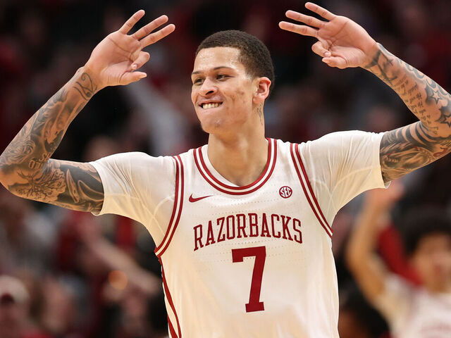 DALLAS, TEXAS - DECEMBER 13: Trevon Brazile #7 of the Arkansas Razorbacks reacts after scoring during the second half against the Texas Tech Red Raiders at American Airlines Center on December 13, 2025 in Dallas, Texas.