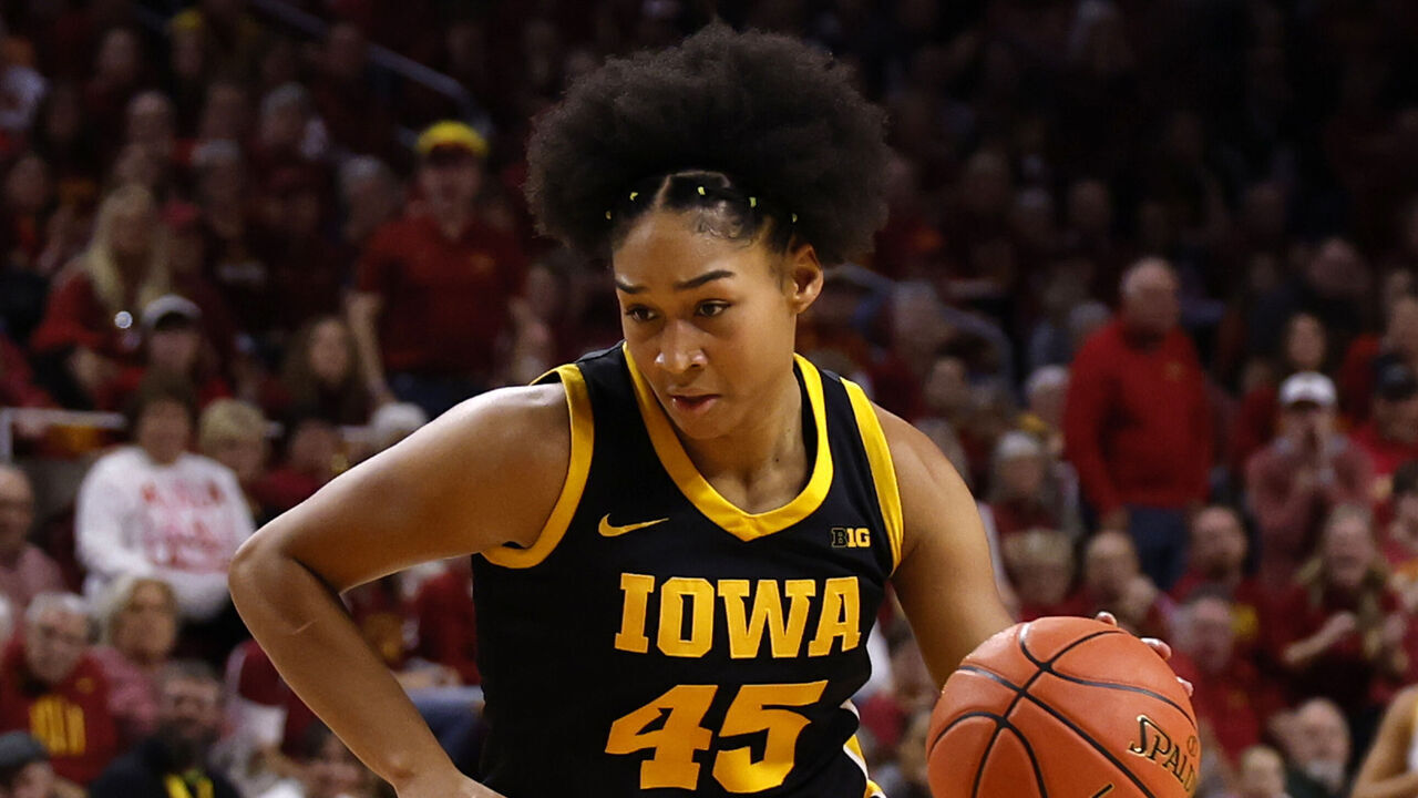 AMES, IA - DECEMBER 10: Forward Hannah Stuelke #45 of the Iowa Hawkeyes drives the ball in the second half of play at Hilton Coliseum on December 10, 2025, in Ames, Iowa. The Iowa State Cyclones won 74-69 over the Iowa Hawkeyes.