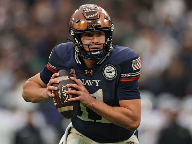 BALTIMORE, MARYLAND - DECEMBER 13: Quarterback Blake Horvath #11 of the Navy Midshipmen rushes with the ball against the Army Black Knights during the first half in the 126th America's Game between the Army Black Knights and the Navy Midshipmen at M&T Bank Stadium on December 13, 2025 in Baltimore, Maryland.
