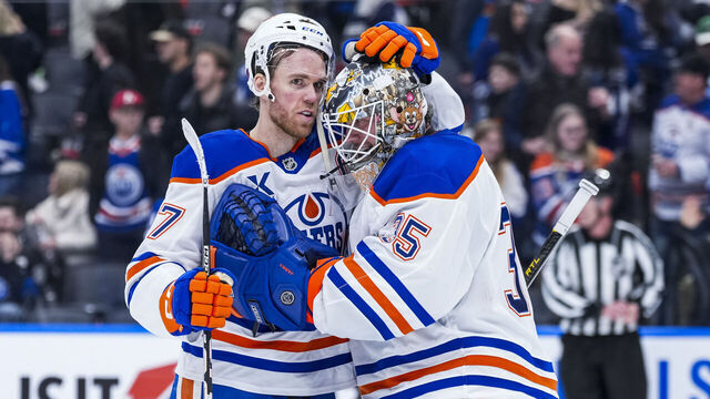 TORONTO, CANADA - DECEMBER 13: Connor McDavid #97 congratulates Tristan Jarry #35 of the Edmonton Oilers on a win over the Toronto Maple Leafs during the third period at the Scotiabank Arena on December 13, 2025 in Toronto, Ontario, Canada.