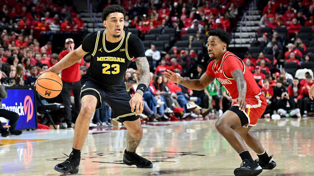 COLLEGE PARK, MARYLAND - DECEMBER 13: Yaxel Lendeborg #23 of the Michigan Wolverines handles the ball in the second half against David Coit #8 of the Maryland Terrapins at Xfinity Center on December 13, 2025 in College Park, Maryland.