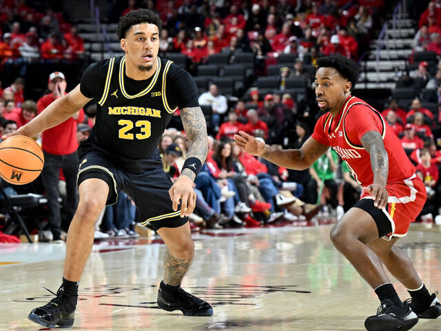 COLLEGE PARK, MARYLAND - DECEMBER 13: Yaxel Lendeborg #23 of the Michigan Wolverines handles the ball in the second half against David Coit #8 of the Maryland Terrapins at Xfinity Center on December 13, 2025 in College Park, Maryland.