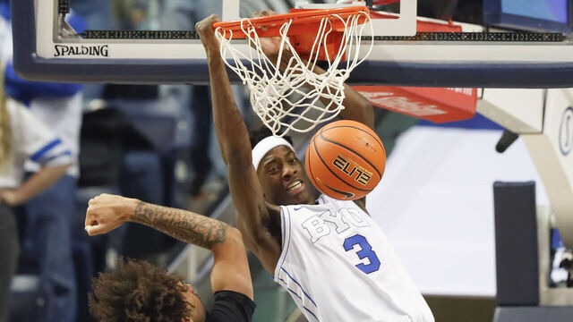 PROVO, UT - DECEMBER 13: AJ Dybantsa #3 of the Brigham Young Cougars dunks over Osiris Grady #9 of the University of California Riverside Highlanders during the first half of their game at the Marriott Center on December 13, 2025 in Provo, Utah.