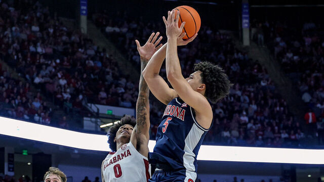 BIRMINGHAM, ALABAMA - DECEMBER 13: Brayden Burries #5 of the Arizona Wildcats shoots a second half shot over Labaron Philon #0 of the Alabama Crimson Tide during the C.M. Newton Classic at Legacy Arena at the BJCC on December 13, 2025 in Birmingham, Alabama.