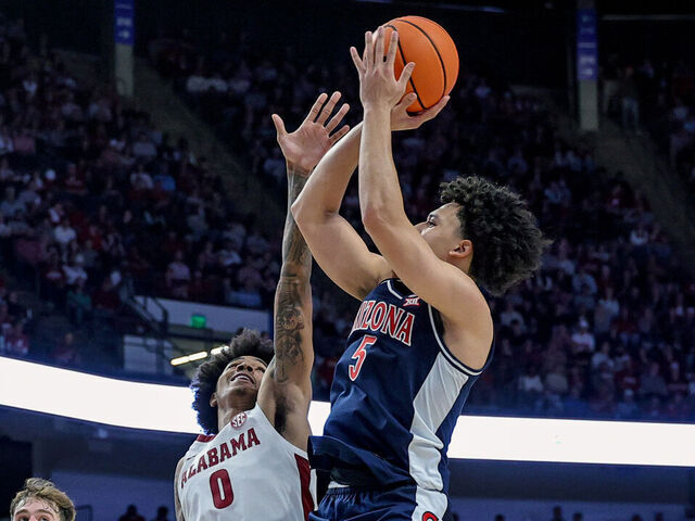 BIRMINGHAM, ALABAMA - DECEMBER 13: Brayden Burries #5 of the Arizona Wildcats shoots a second half shot over Labaron Philon #0 of the Alabama Crimson Tide during the C.M. Newton Classic at Legacy Arena at the BJCC on December 13, 2025 in Birmingham, Alabama.