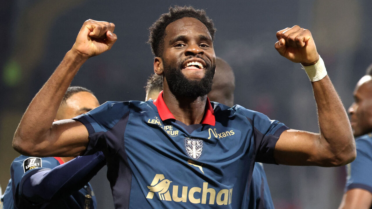 Lens' French forward #11 Odsonne Edouard celebrates after scoring his team second goal during the French L1 football match between RC Lens and OGC Nice at the Stade Bollaert-Delelis in Lens, northern France, on December 14, 2025.