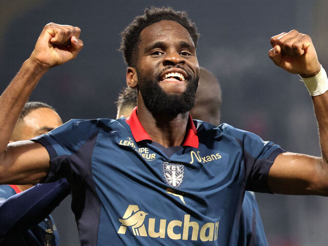 Lens' French forward #11 Odsonne Edouard celebrates after scoring his team second goal during the French L1 football match between RC Lens and OGC Nice at the Stade Bollaert-Delelis in Lens, northern France, on December 14, 2025.