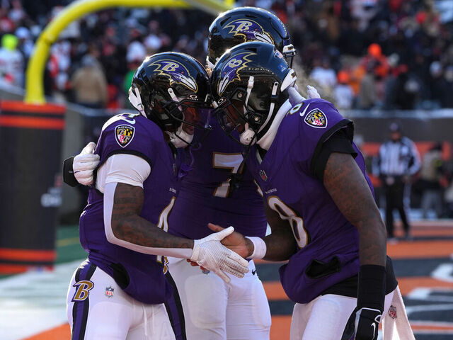 CINCINNATI, OHIO - DECEMBER 14: Zay Flowers #4 celebrates a second quarter touchdown with Lamar Jackson #8 of the Baltimore Ravens during the second quarter against the Cincinnati Bengals at Paycor Stadium on December 14, 2025 in Cincinnati, Ohio.