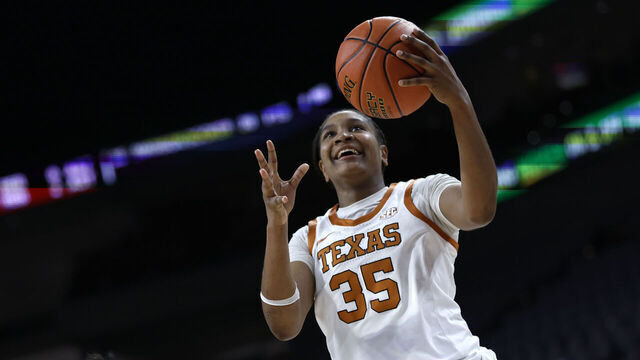 FORT WORTH, TEXAS - DECEMBER 14: Madison Booker #35 of the Texas Longhorns goes to the basket as Yuting Deng #7 of the Baylor Bears defends during the second half at Dickies Arena on December 14, 2025 in Fort Worth, Texas.