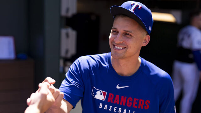 ARLINGTON, TX - SEPTEMBER 25: Corey Seager #5 of the Texas Rangers has a laugh with a teammate in the dugout during a game against the Minnesota Twins at Globe Life Field on September 25, 2025 in Arlington, Texas.