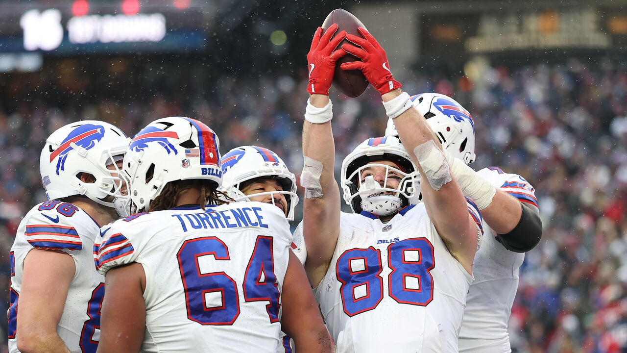 FOXBOROUGH, MASSACHUSETTS - DECEMBER 14: Dawson Knox #88 of the Buffalo Bills celebrates a touchdown during the fourth quarter against the New England Patriots at Gillette Stadium on December 14, 2025 in Foxborough, Massachusetts.