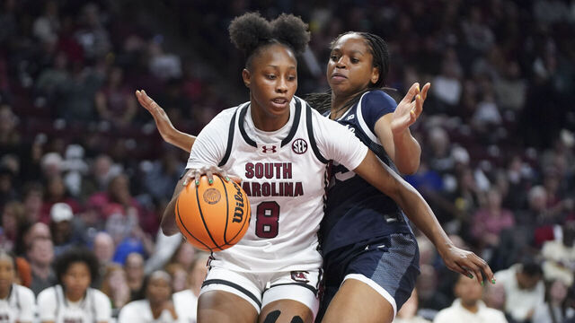 COLUMBIA, SOUTH CAROLINA - DECEMBER 14: Joyce Edwards #8 of the South Carolina Gamecocks dribbles the ball against Rachael Okokoh #25 of the Penn State Nittany Lions (R) during the fourth quarter of the NCAA women's basketball game at Colonial Life Arena on December 14, 2025 in Columbia, South Carolina.