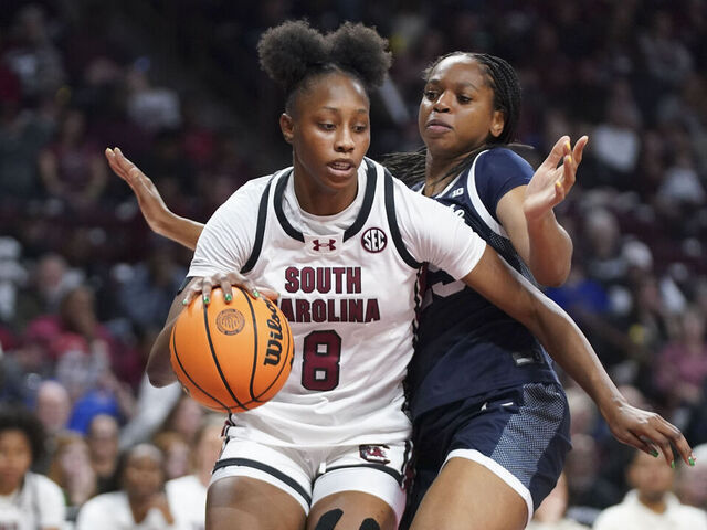 COLUMBIA, SOUTH CAROLINA - DECEMBER 14: Joyce Edwards #8 of the South Carolina Gamecocks dribbles the ball against Rachael Okokoh #25 of the Penn State Nittany Lions (R) during the fourth quarter of the NCAA women's basketball game at Colonial Life Arena on December 14, 2025 in Columbia, South Carolina.