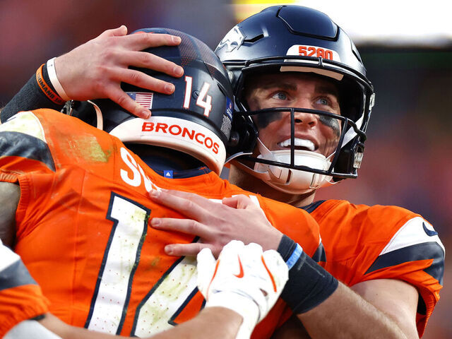 DENVER, COLORADO - DECEMBER 14: Bo Nix #10 of the Denver Broncos celebrates after throwing a touchdown pass to Courtland Sutton #14 during the third quarter against the Green Bay Packers at Empower Field At Mile High on December 14, 2025 in Denver, Colorado.