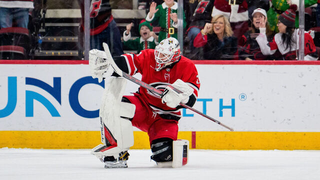 RALEIGH, NORTH CAROLINA - DECEMBER 14: Brandon Bussi #32 of the Carolina Hurricanes reacts after defeating the Philadelphia Flyers in a shootout during their game at the Lenovo Center on December 14, 2025 in Raleigh, North Carolina.