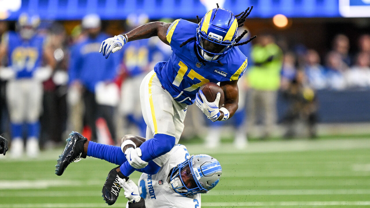 Los Angeles, CA - December 14:Los Angeles Rams Davante Adams (17) goes up over Detroit Lions Daniel Thomas (2) for a gain during third quarter action at SoFi Stadium on Sunday, December 13, 2025. The Rams defeated the Lions 41-33 to clinch a playoff birth. g