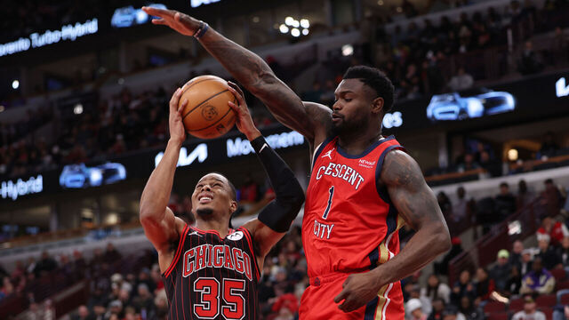 CHICAGO, ILLINOIS - DECEMBER 14: Zion Williamson #1 of the New Orleans Pelicans guards Isaac Okoro #35 of the Chicago Bulls during the second half at the United Center on December 14, 2025 in Chicago, Illinois.
