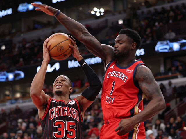 CHICAGO, ILLINOIS - DECEMBER 14: Zion Williamson #1 of the New Orleans Pelicans guards Isaac Okoro #35 of the Chicago Bulls during the second half at the United Center on December 14, 2025 in Chicago, Illinois.