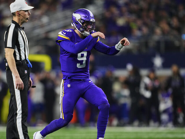 ARLINGTON, TX - DECEMBER 14: J.J. McCarthy #9 of the Minnesota Vikings reacts after a play against the Dallas Cowboys during the first half of an NFL football game at AT&T Stadium on December 14, 2025 in Arlington, Texas.