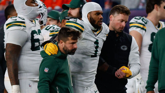 DENVER, CO - DECEMBER 14: Micah Parsons #1 of the Green Bay Packers walks off the field with a knee injury during the third quarter against the Denver Broncos at Empower Field at Mile High on December 14, 2025 in Denver, Colorado.