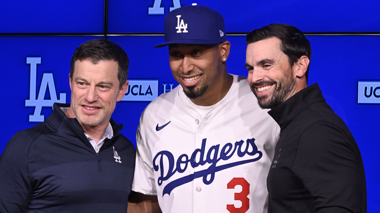 Los Angeles, CA - December 12: Former New York Mets closer Edwin Diaz, center, introduced to the Los Angeles Dodgers by Andrew Friedman, President of baseball operations and Brandon Gomes, General manager at Dodger Stadium in Los Angeles on Friday, December 12, 2025.