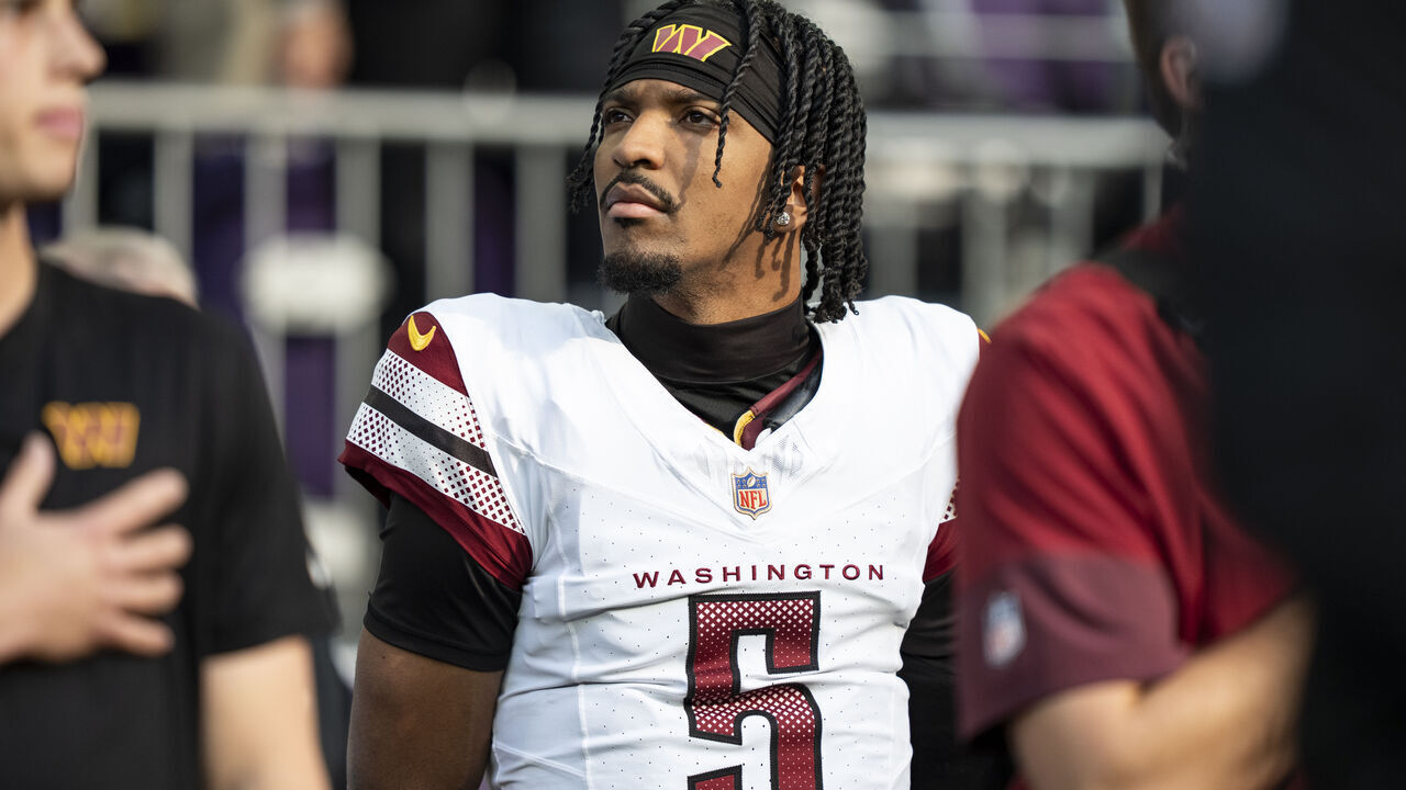 MINNEAPOLIS, MINNESOTA - DECEMBER 7: Jayden Daniels #5 of the Washington Commanders looks on during an NFL football game against the Minnesota Vikings at U.S. Bank Stadium on December 07, 2025 in Minneapolis, Minnesota.