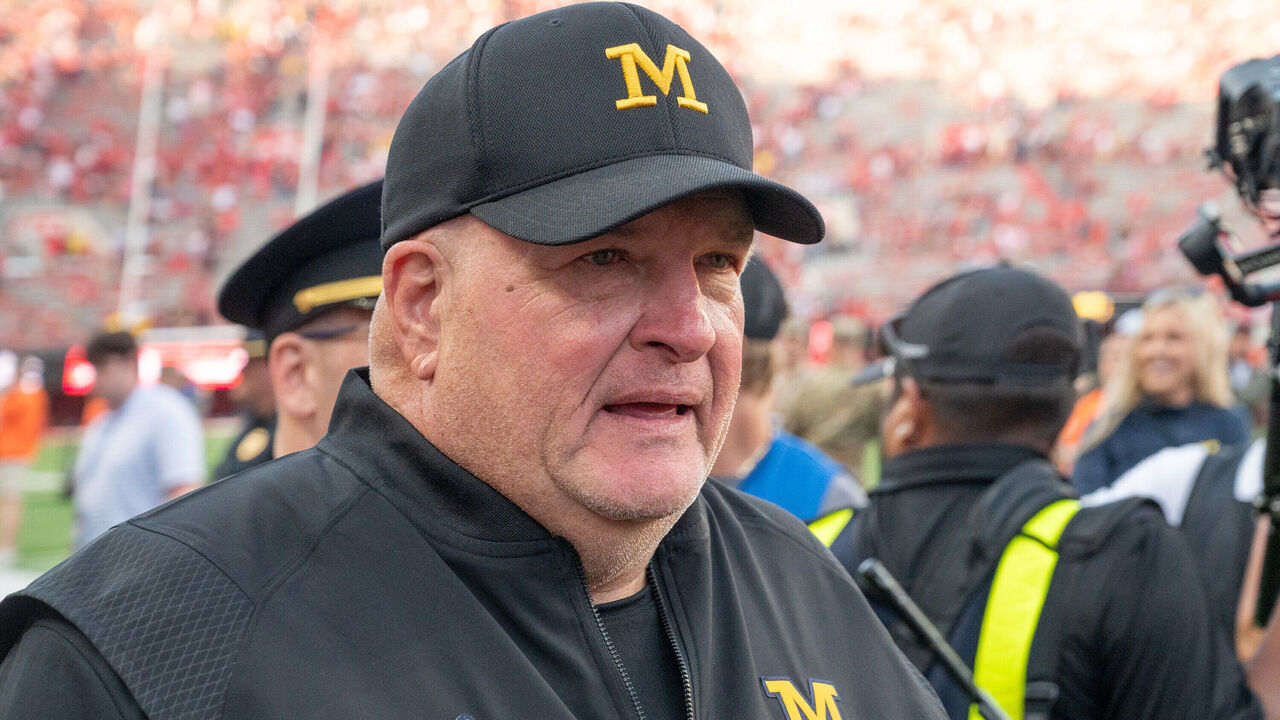 LINCOLN, NEBRASKA - SEPTEMBER 20: Acting head coach Biff Poggi of the Michigan Wolverines walks off the field after the win against the Nebraska Cornhuskers at Memorial Stadium on September 20, 2025 in Lincoln, Nebraska.