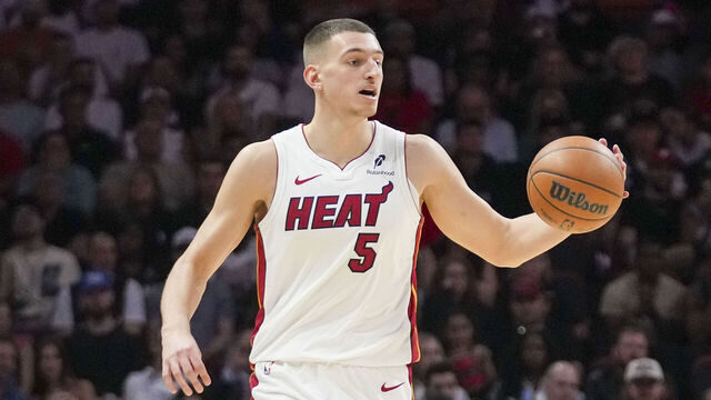 MIAMI, FLORIDA - NOVEMBER 08: Nikola Jović #5 of the Miami Heat brings the ball down the court during the third quarter against the Portland Trail Blazers at Kaseya Center on November 08, 2025 in Miami, Florida.