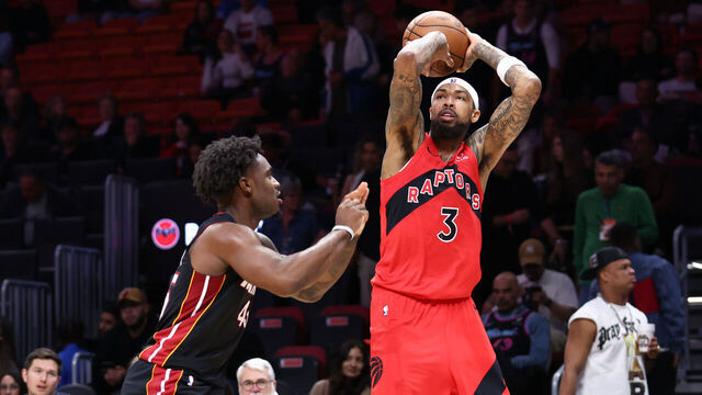 MIAMI, FLORIDA - DECEMBER 15: Brandon Ingram #3 of the Toronto Raptors shoots the ball over Davion Mitchell #45 of the Miami Heat during the fourth quarter of the game at Kaseya Center on December 15, 2025 in Miami, Florida.